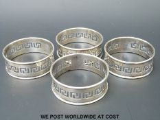 Four hallmarked silver napkin rings with Greek key decoration (42g)