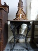 A cast iron pub table with wooden top by Gaskell & Chambers Ltd.