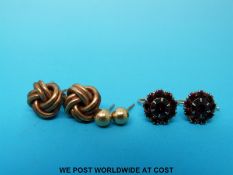 A pair of 9ct gold earrings in the form of knots,