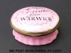 An 18thC Bilston enamel pill box 'A Trifle from Warwick'. 2.5cm tall, 4.
