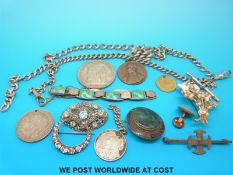 A silver bracelet decorated with blue and green enamel, a moss agate brooch, silver brooches,