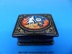 A small Russian lacquer box decorated with a man having a vision of a fish