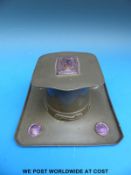 A Liberty & Co pewter and purple enamel inkwell in the Art Nouveau / Arts & Crafts style,