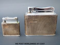 A hallmarked silver Calibri Monopol table lighter together with a smaller example