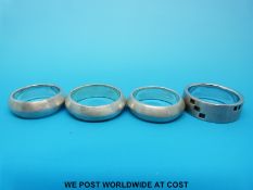 Four silver rings with matte finish