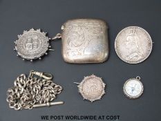 A silver plated vesta, mounted coins,
