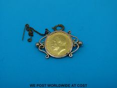 A 1912 gold full sovereign in 9ct gold mount (11.