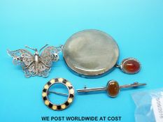 A Kensington Art ware brooch, filigree butterfly brooch and two other silver brooches.
