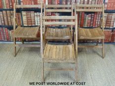 Four vintage wooden folding chairs