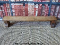A small Arts and Crafts oak child's bench or step (H16 x L86 x D12)