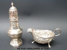 A hallmarked silver sugar sifter and a hallmarked silver sauce boat (195g)
