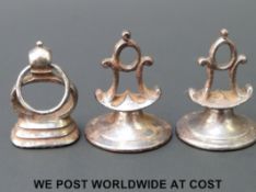 Three late 18thC cut steel fobs, two with monograms the other with hobnail pattern, tallest 2.