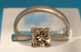 A platinum ring set with a 1ct princess cut diamond with a matching platinum wedding band