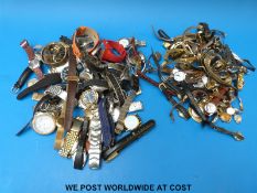 A large collection of ladies and gentleman's wristwatches, some mechanical, to include Timex,
