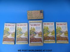 Five boxes of pencil crayons together with a box of dried shamrock