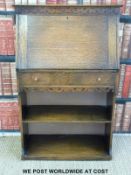 An Elliston & Cavell Arts and Crafts style ladies or student oak bureau (H106 x W69 x D31cm)