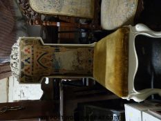 A carved Prie Dieu chair with tapestry book