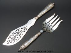 A pair of Victorian hallmarked silver fish servers with pierced blades/tynes,