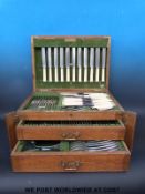 An oak cased 12 place canteen of plated cutlery
