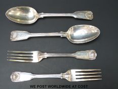 Two hallmarked silver table spoons, length 22cm, and two hallmarked silver Victorian table forks,
