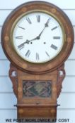 A scrolled drop dial wall clock with coloured wood banded and marquetry inlay,