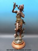A spelter figure of a classical lady with bird (50cm tall)