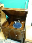 A free standing Yagerphone 'all British' wind up gramophone in oak case with built in speakers