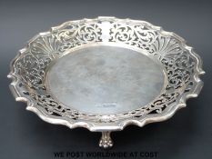 A Walker & Hall hallmarked silver pedestal dish with pierced decoration and shaped edge raised on
