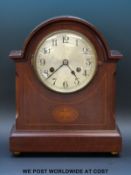 A mahogany cased two train mantel clock, steel dial, Arabic numerals, inlaid decoration to case,