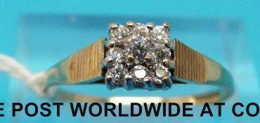 A 9ct gold ring set with cubic zirconia in a square setting (size O)