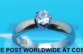 A yellow metal ring marked 750 set with an old cut diamond measuring approximately 0.