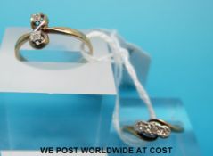 A 9ct gold ring set with three diamonds in a platinum illusion setting and a 9ct gold ring set with