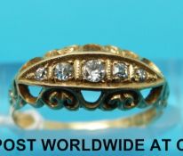An 18ct gold ring set with five diamonds (size M)