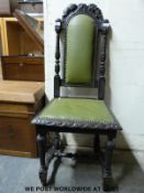 A Victorian carved oak hall chair