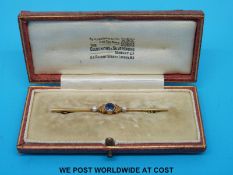 A 15ct gold brooch set with a sapphire and seed pearls in original Goldsmiths & Silversmiths