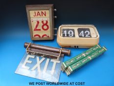 A vintage 'Exit' sign with illumination feature together with four spare bulbs,