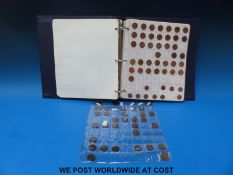 A coin album containing an amateur collection of English coinage including farthings Charles II