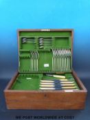 A Walker and Hall part cutlery canteen in oak case