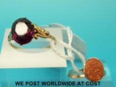 A yellow metal ring marked 9ct gold set with an amethyst and a yellow metal ring marked 9ct gold