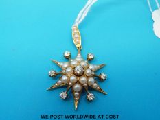 A Victorian / Edwardian pendant set with pearls and seven old cut diamonds in a star cluster