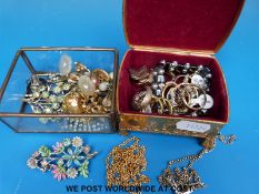 A collection of costume jewellery to include rings, earrings, silver chain, brooches,