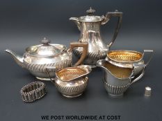 A four piece hallmarked silver tea set, various hallmarks but similar design,