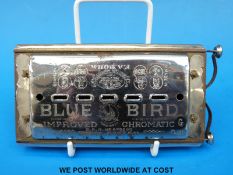 A double sided C/G chromatic Blue Bird harmonica by Bohm of Germany