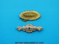 A 9ct gold brooch set with seed pearls and a sapphire and a 9ct gold Victorian brooch (7.
