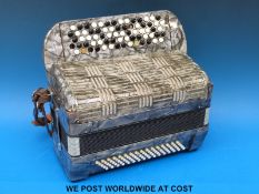 An 80 Bass Hohner Chromatic accordion in grey pearloid finish