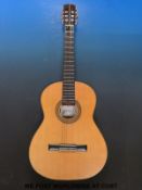 A six string 'artist made' acoustic guitar,