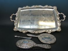 A hallmarked silver dressing table and silver handled shoe horn together with a large silver plated