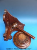 A large auctioneer's gavel and block and a mahogany corner bracket