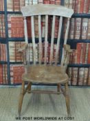 A 19thC elm seated Windsor armchair