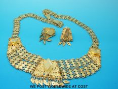 A filigree necklace and matching earrings